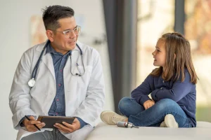 1800ss_getty_rf_young_girl_talking_with_pediatrician (2)
